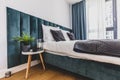Cozy bedroom with comfortable bed in modern studio apartment Royalty Free Stock Photo