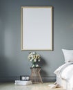 Cozy bedroom with empty poster frame. Frame mockup in interior. Royalty Free Stock Photo