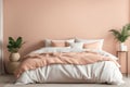 Cozy Bedroom Interior with Plush Peach Bedding and Lush Greenery Royalty Free Stock Photo