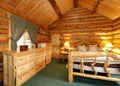 Cozy bedroom in log cabin house Royalty Free Stock Photo