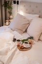 Cozy bedroom with a queen-sized bed, neatly made and adorned with a tray of snacks