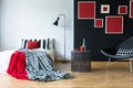 Cozy bedroom with red paintings Royalty Free Stock Photo