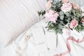 Cozy bedroom still life scene. Wedding, birthday bouquet of pink roses, peony flowers and eucalyptus branches. Silk Royalty Free Stock Photo