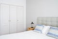 Cozy bedroom with wardrobe and comfortable bed Royalty Free Stock Photo