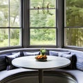 A cozy breakfast nook with a built-in bench, a round table, and natural light from a bay window4, Generative AI Royalty Free Stock Photo