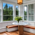 A cozy breakfast nook with a built-in bench, a round table, and natural light from a bay window1, Generative AI Royalty Free Stock Photo