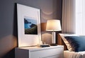 Cozy bright bedroom interior with bedside table and table lamp with photo or painting frame mockup,