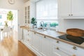 Cozy spacious white kitchen made in classic style Royalty Free Stock Photo