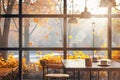 Cozy cafe interior with beautiful autumn view