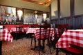 Cozy cafe with tables covered with tablecloths