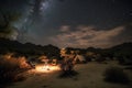 cozy campsite under starry night sky in desert Royalty Free Stock Photo