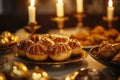 Cozy candlelit dinner setting with freshly baked bread rolls Royalty Free Stock Photo