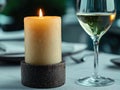 Cozy candlelit dinner setting with wine glass Royalty Free Stock Photo
