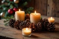 Cozy candlelit holiday display with pine cones and christmas decor Royalty Free Stock Photo