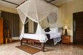 Cozy canopy bed in traditional balinese house