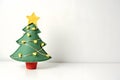 cartoon A felt Christmas tree with small decorative lights on white background Royalty Free Stock Photo