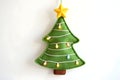cozy cartoon A felt Christmas tree with small decorative lights on a white background Royalty Free Stock Photo