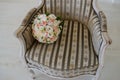 Cozy chair in the photo studio with wedding decoration and flowers bouqet