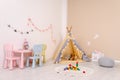 Cozy child room interior with play tent, table