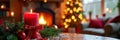 Cozy christmas ambiance with candle and decorated tree by fireplace Royalty Free Stock Photo