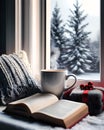 Cozy and Christmas atmosphere with cushions, steaming mug, book