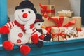 Cozy christmas background. Toy snowmen and presents under new ye Royalty Free Stock Photo