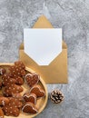 Cozy Christmas Greetings: Gingerbread Cookies, Envelope, and Pinecone Royalty Free Stock Photo