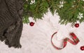 Cozy christmas planning with scarf and snowflakes ornaments and ribbon on marble background