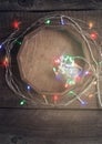 Cozy christmas Vintage background With natural decoration. Multicolored electric garland and bokeh lights Royalty Free Stock Photo