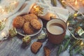 cozy Christmas and winter setting with homemade cookies, coffee and New Year decorations Royalty Free Stock Photo