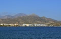 Cozy city Ierapetra on the Libyan sea coat against the background of distant mountains. Crete island, Greece. Royalty Free Stock Photo