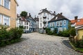 Cozy cobbled square in Bergen surrounded by colorful wooden houses, Norway