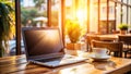 Cozy Coffee Shop Workspace A Perfect Remote Work Setup with a Blank Laptop Screen Royalty Free Stock Photo
