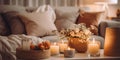 A cozy coffee table setup with candles and flowers, perfect for home decor or event planning Royalty Free Stock Photo