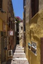 Cozy colorful alleys with steps like here in Zampeliou street in Chania, Greece