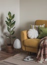 A cozy corner - an armchair with pillows and a blanket, a home flower, a lamp. Cozy home interior