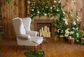 A cozy corner with a soft arm-chair, a table, candles in Rustic style