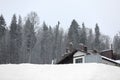 Cozy cottage on snowy hill. Winter Royalty Free Stock Photo
