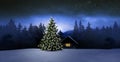 Cozy cottage in wintertime at night Royalty Free Stock Photo