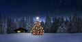 Cozy cottage in wintertime at night Royalty Free Stock Photo