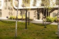 cozy courtyard with benches, trees near the high-rise city house