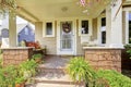 Cozy covered porch with white columns in American craftsman house