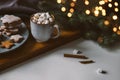 Cozy cup with hot cocoa, marshmallows and gingerbread