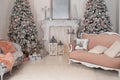 Cozy decorated room for Xmas. Decorated Christmas tree with gifts, fireplace and sofa. Christmas room interior home. Stylish inter Royalty Free Stock Photo