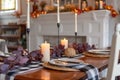 Cozy dining table by a fireplace decorated for fall