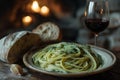 Cozy dinner setting with pesto pasta and red wine