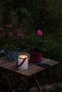 Cozy evening garden summer scene with candle light