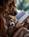 Cozy evening reading with pet relaxation and warmth Royalty Free Stock Photo