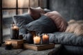Cozy evening scene with candles and books by the window - concept of warmth, mindfulness and quiet reflection. Royalty Free Stock Photo