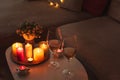 Cozy evening scene with candles, wine glasses and warm lighting Royalty Free Stock Photo